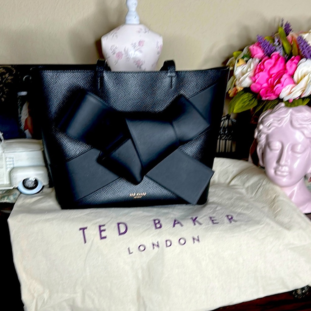 Ted Baker London tote with oversized bow.  Has beautiful rose gold zipper!